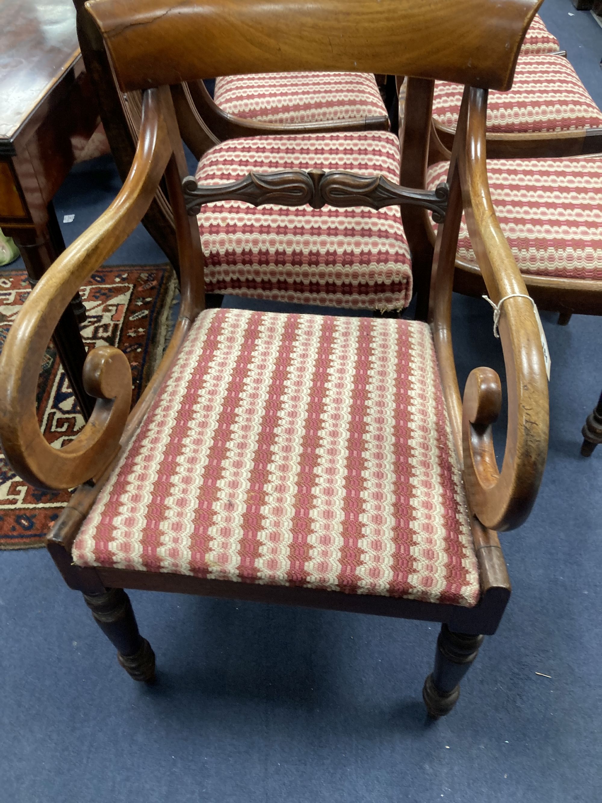 A harlequin set of nine George IV mahogany dining chairs (one having arms)